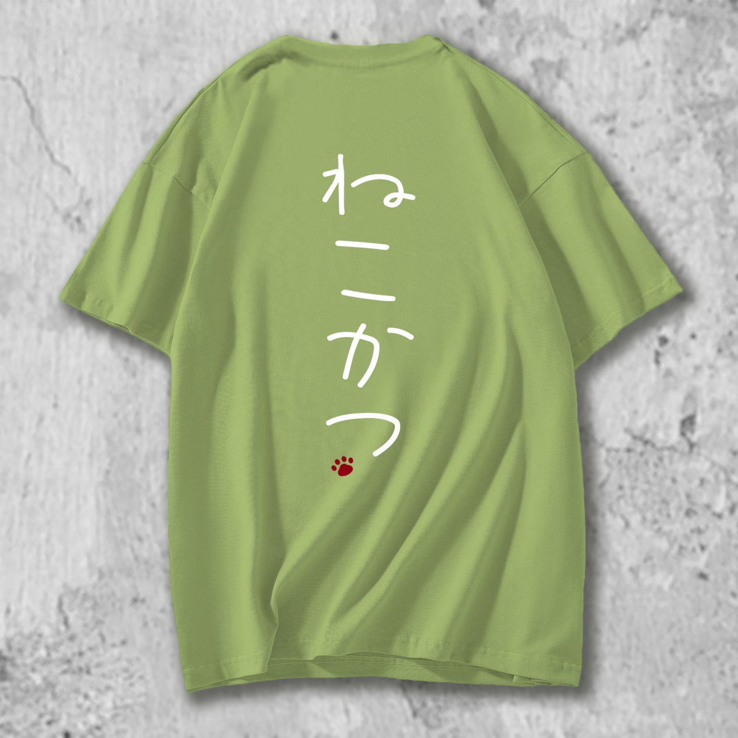 ねこかつのロゴがバックプリントされたTシャツのライトグリーン