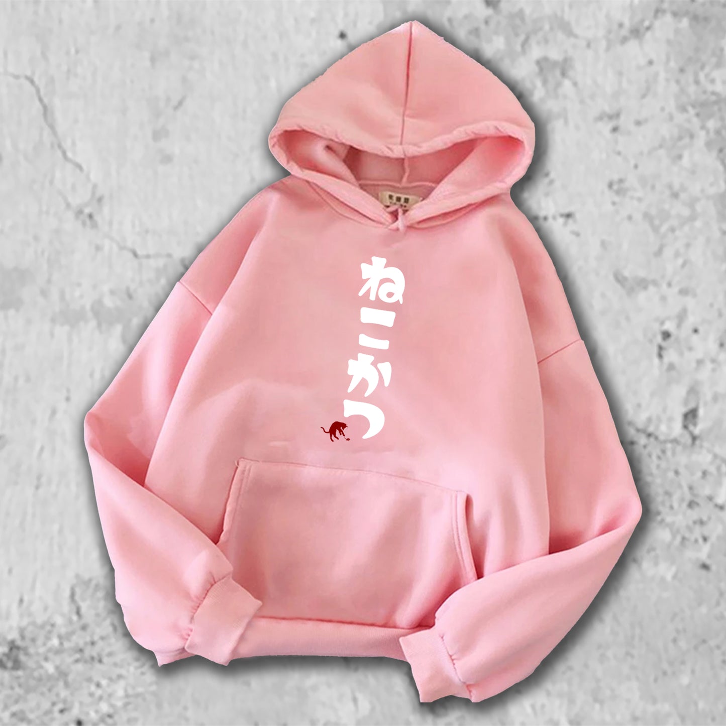 ねこかつとプリントされたTシャツのピンク