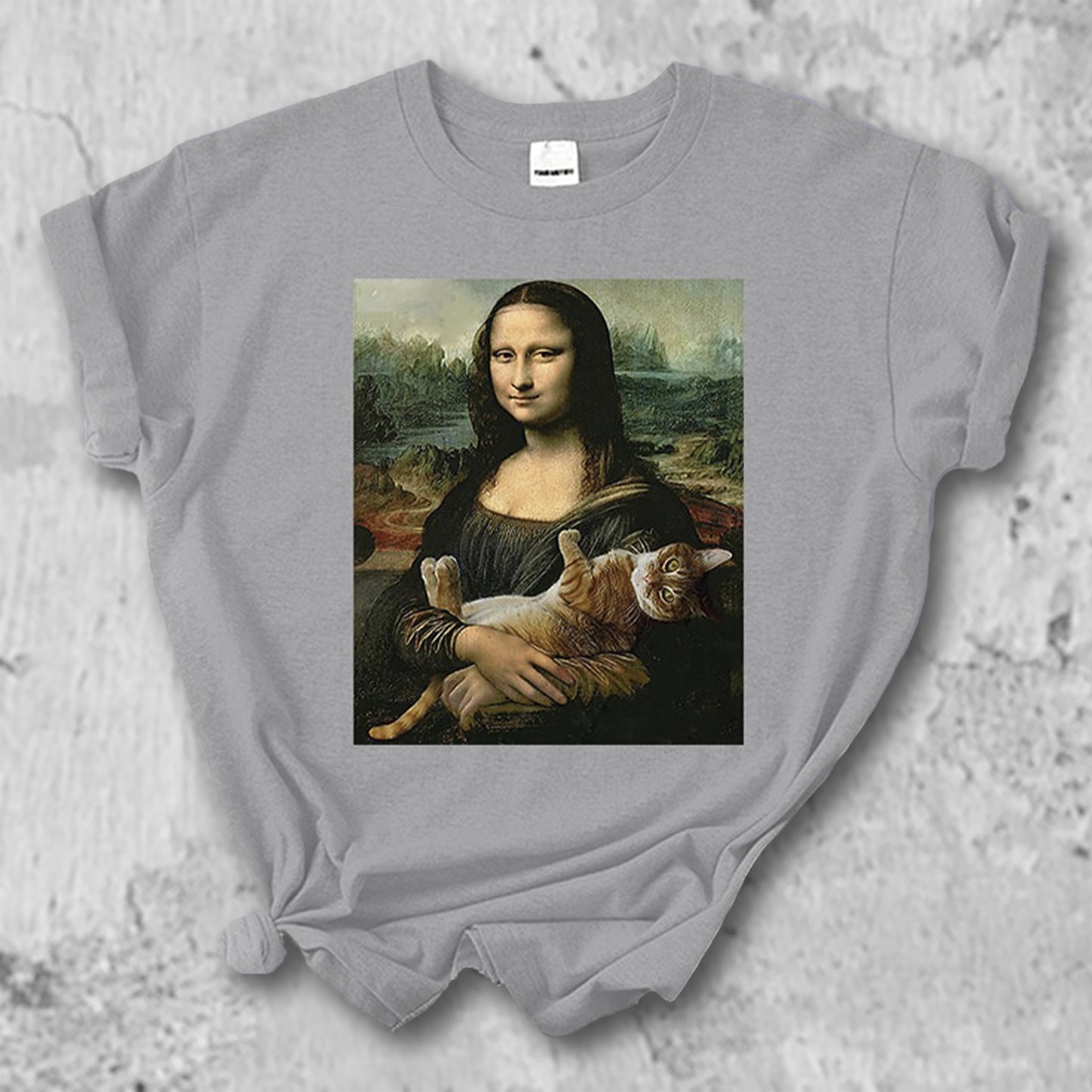 猫を抱いたモナリザのTシャツのグレー