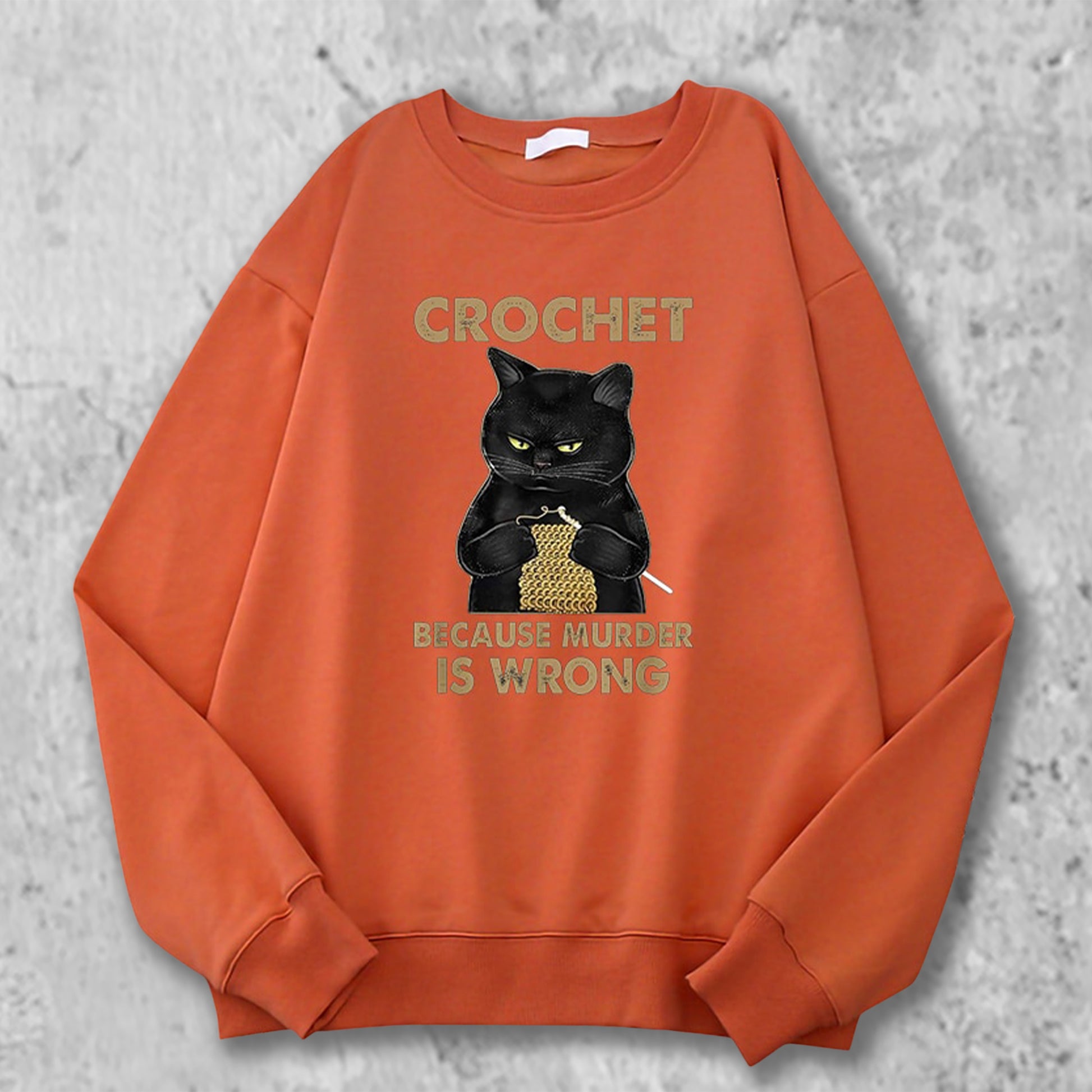 かぎ針編みの猫のスエットシャツのブリックレッド